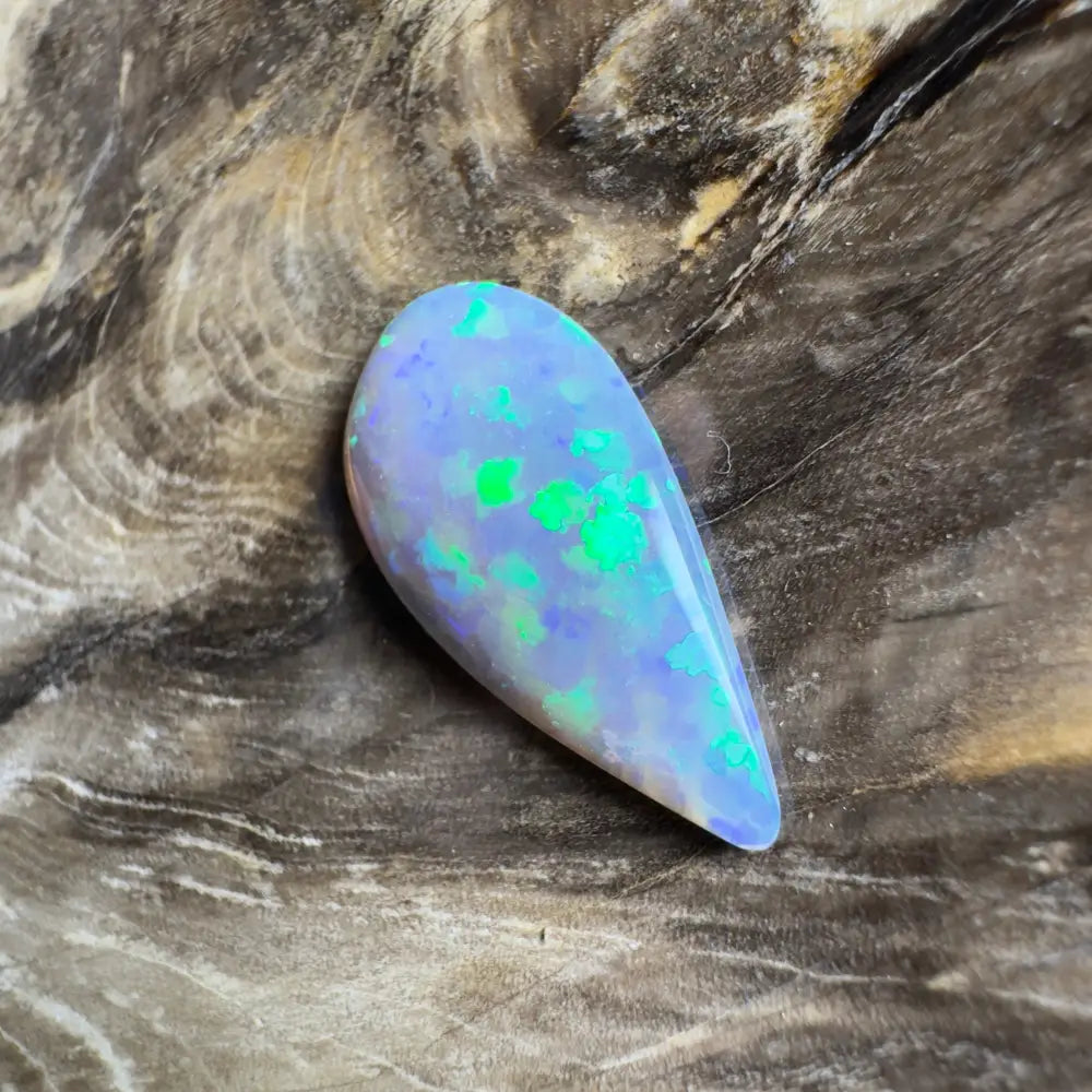 Teardrop-shaped opal with green and blue play-of-color.