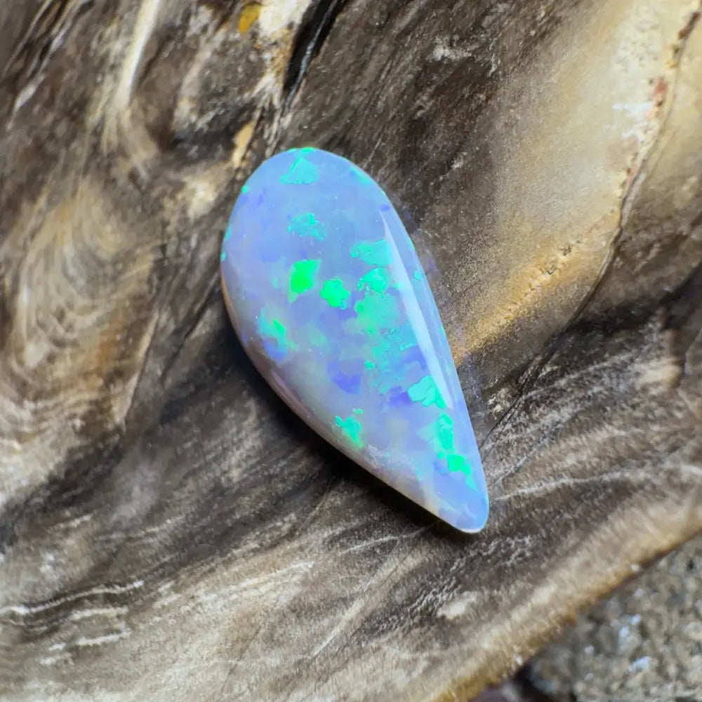 Teardrop-shaped opal with green and blue play-of-color.