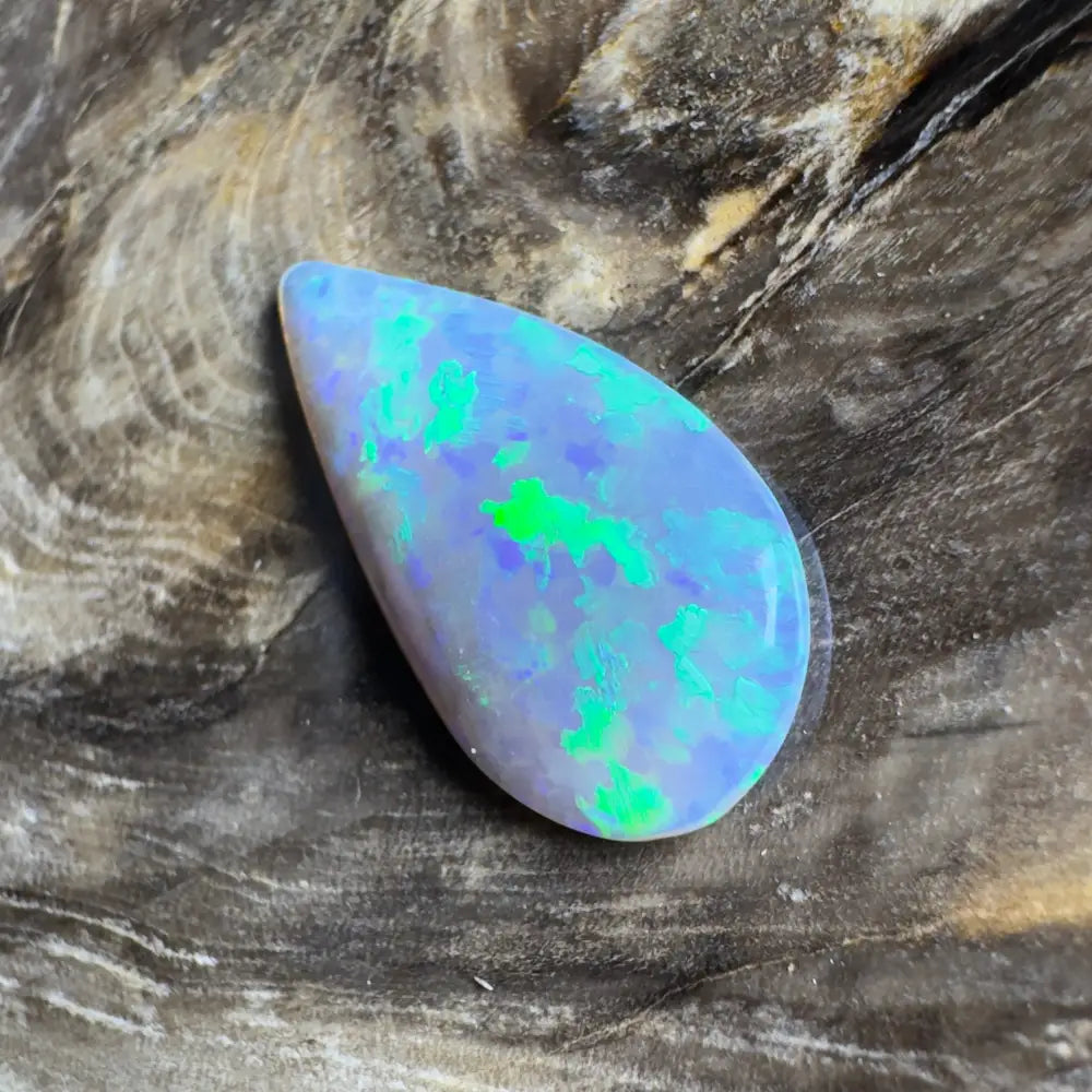 Teardrop-shaped opal with blue and green play-of-color.