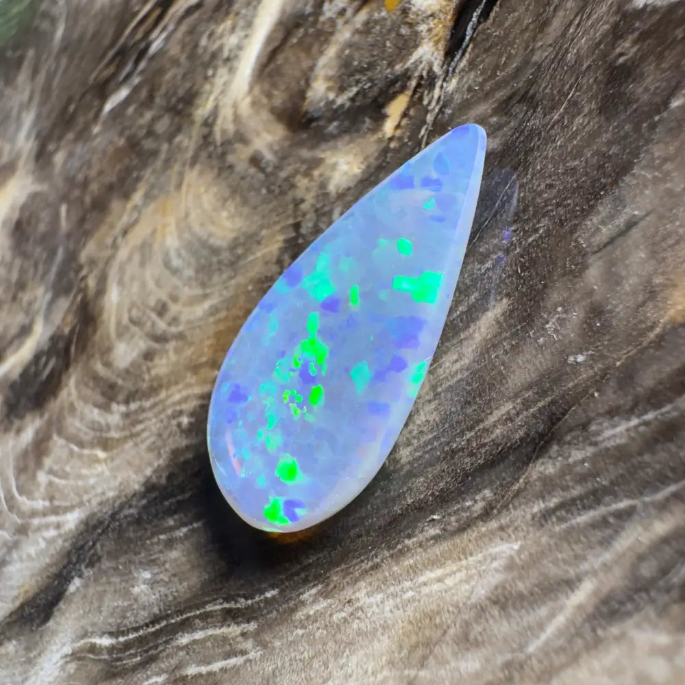 Teardrop-shaped opal with blue and green play-of-color.