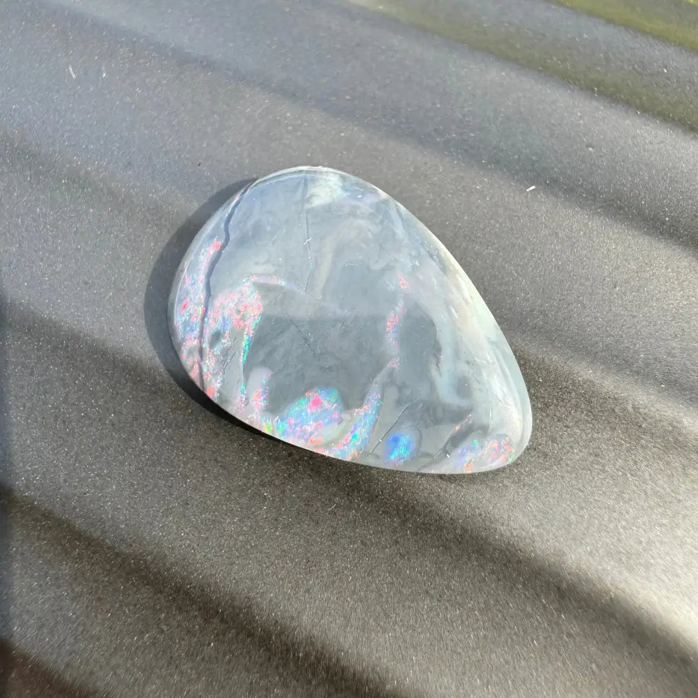 Iridescent polished opal cabochon from 5.7 carat Hand-Cut Solid Lightning Ridge Semi Black Opal
