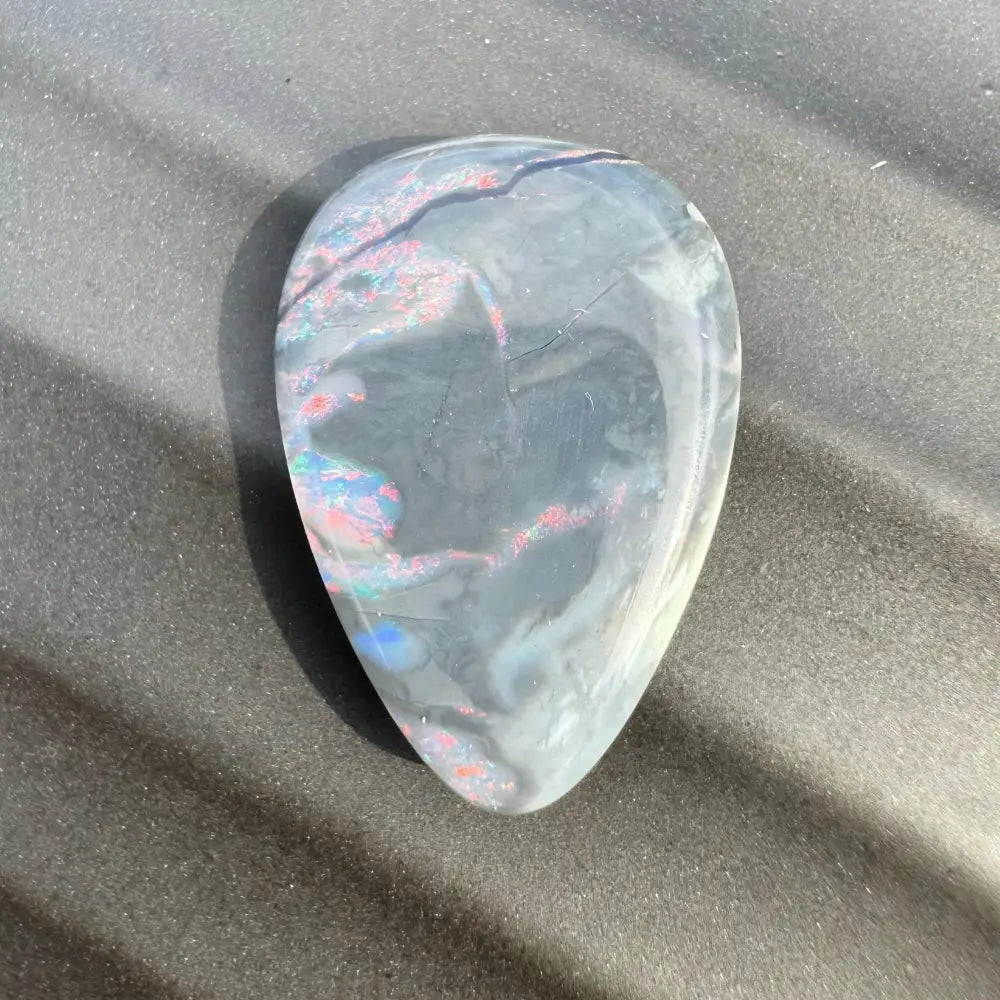 Teardrop-shaped 5.7 carat Opal with iridescent flashes from Lightning Ridge