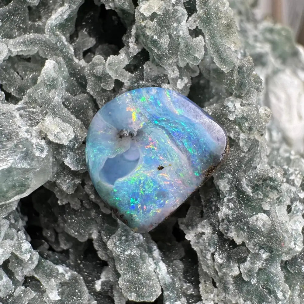 Iridescent blue Queensland Boulder Opal gemstone in the 5.9ct hand-cut jewelry piece