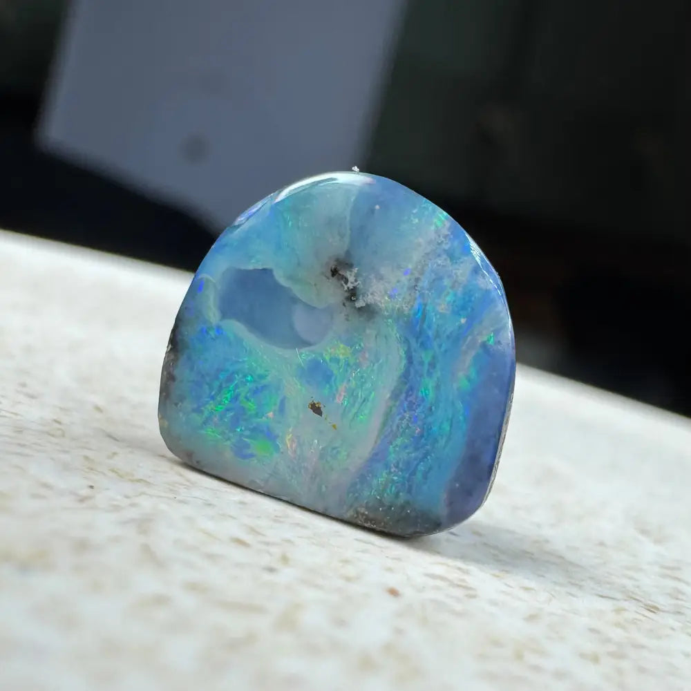 Iridescent blue opal cabochon from the 5.9ct Hand-cut Queensland Boulder Opal jewelry piece