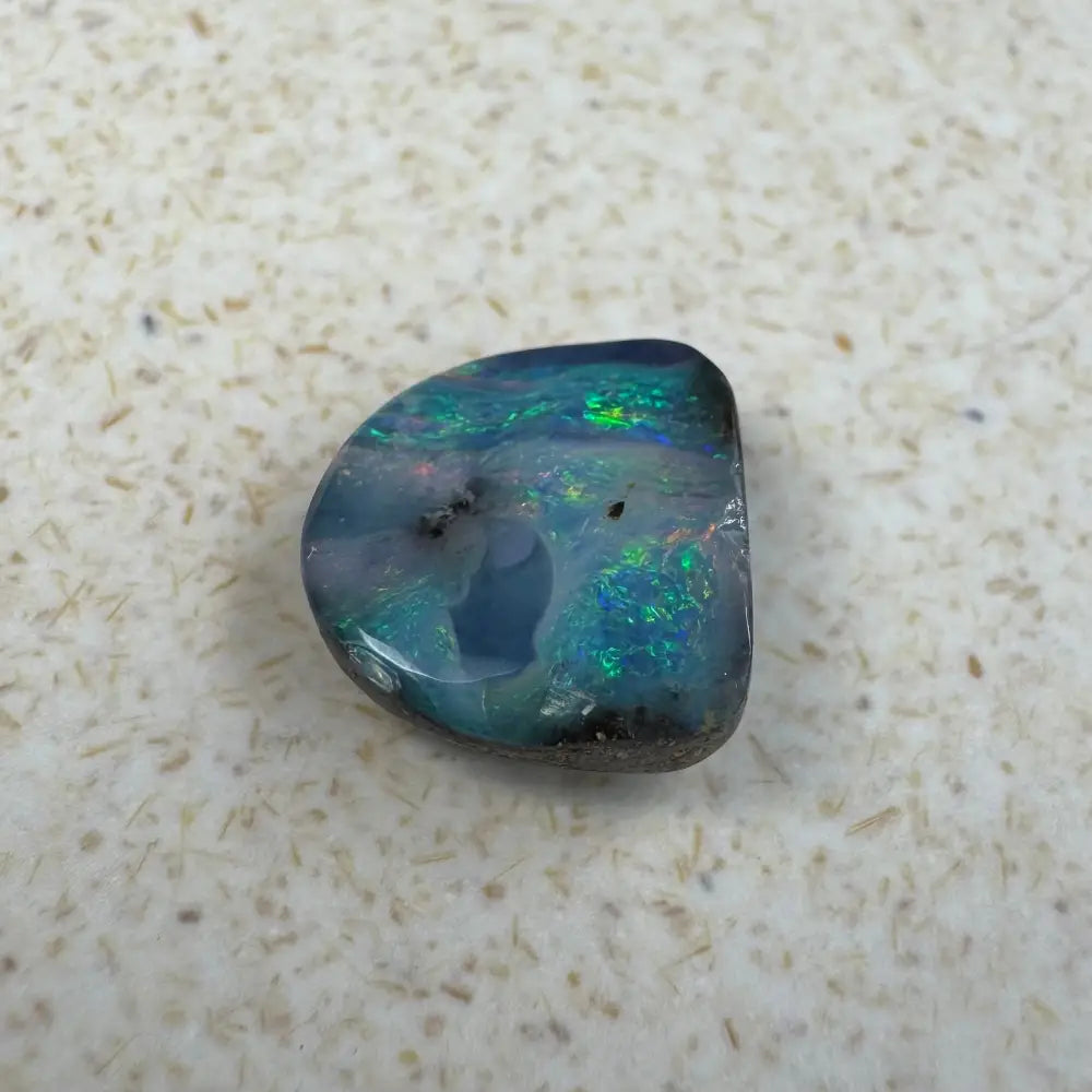 Iridescent opal gemstone from the 5.9ct Hand-cut Queensland Boulder Opal collection