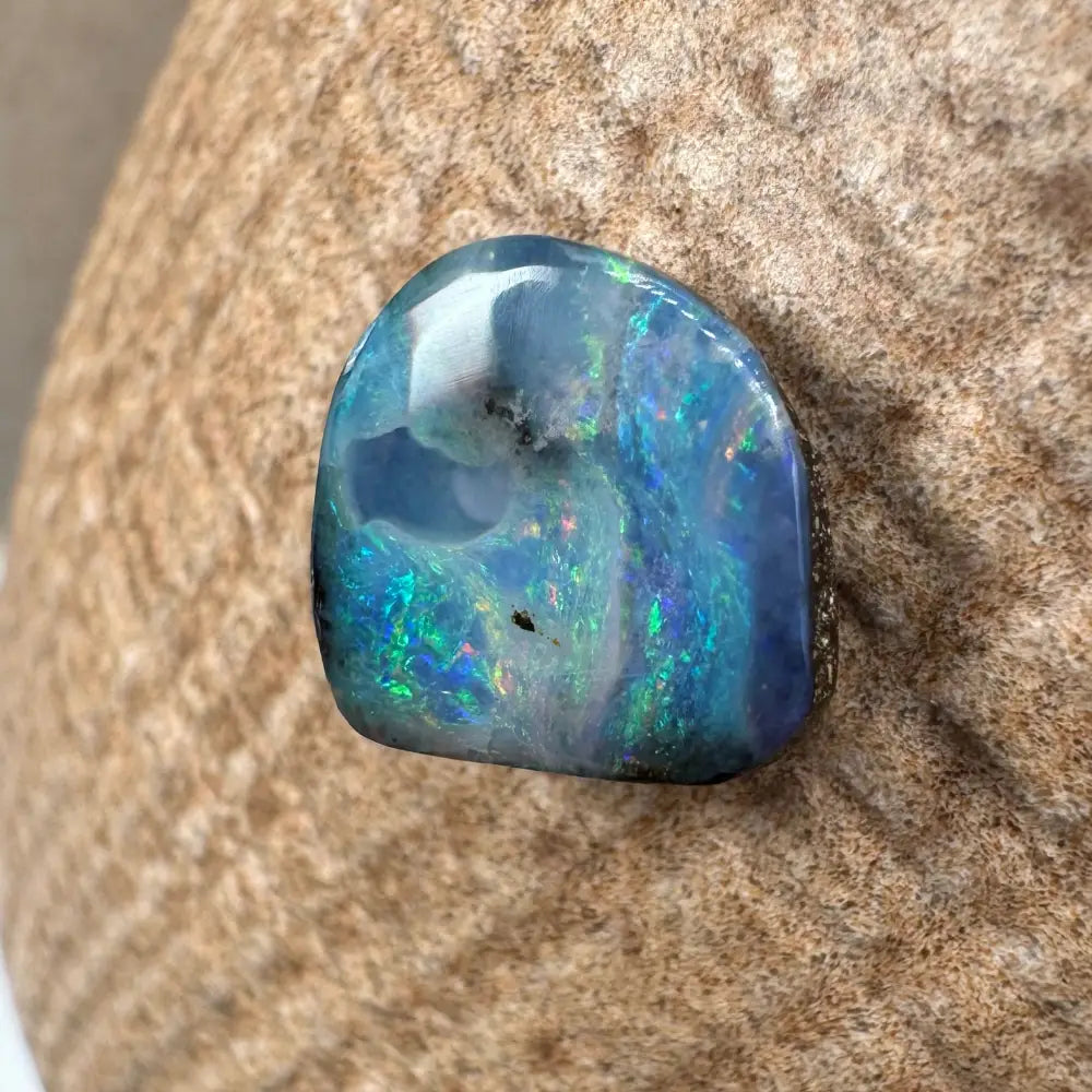 Iridesscent blue-green Queensland Boulder Opal cabochon in a 5.9ct handcrafted setting