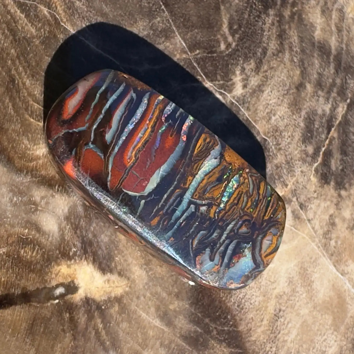 Polished Boulder Opal with vibrant play of colors in 8.3ct hand-cut solid gemstone