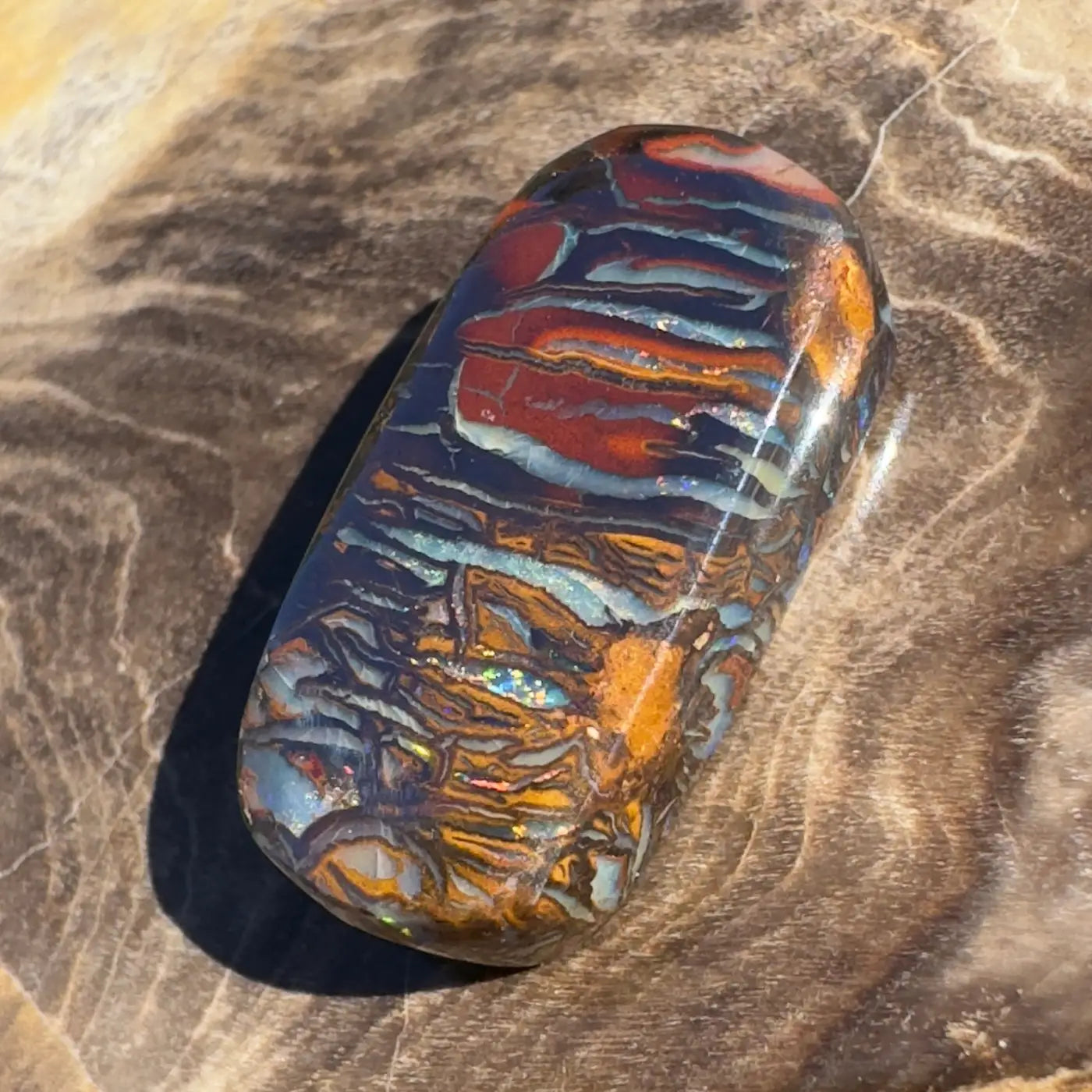 Polished Boulder Opal with vibrant color play in 8.3ct Hand-Cut Solid Boulder Opal product image