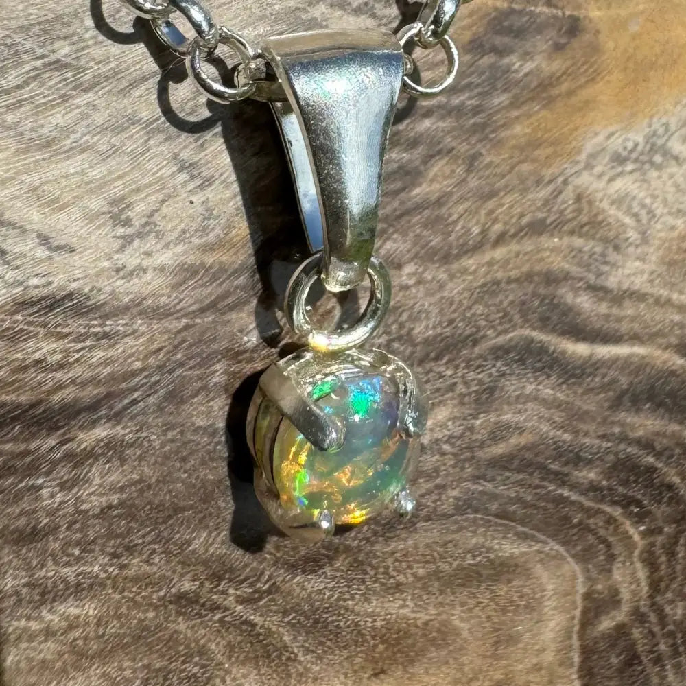 Silver opal pendant necklace featuring a handcrafted 0.2ct Lightning Ridge Opal in sterling silver