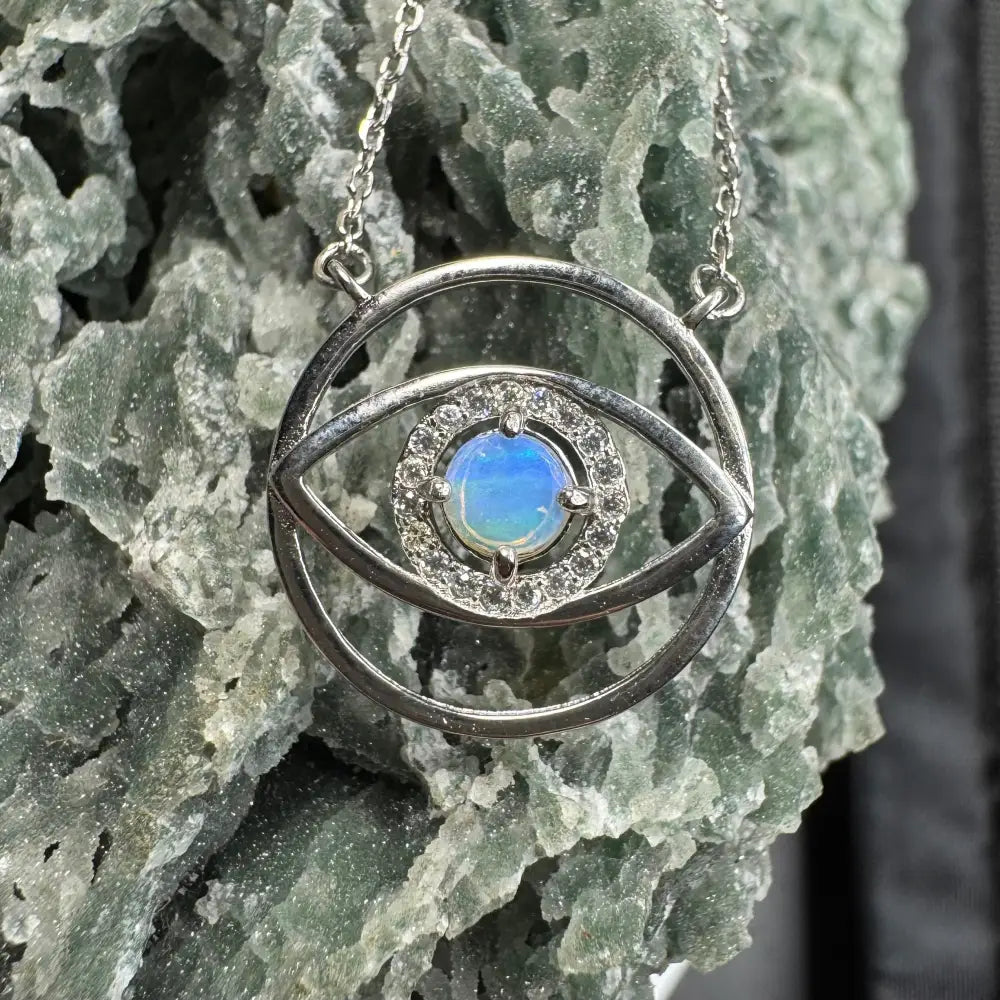 Silver evil eye pendant necklace featuring Lightning Ridge Opal Eye in a Sterling Silver setting