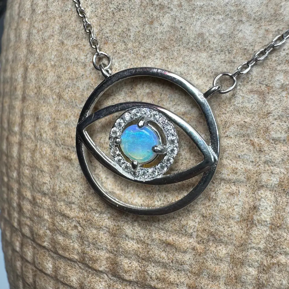 Silver eye-shaped pendant necklace with vibrant opal center from Lightning Ridge in sterling silver