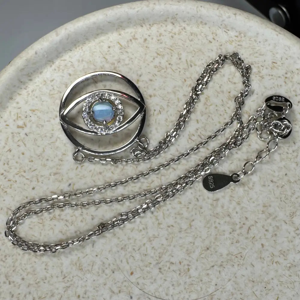 Silver eye pendant necklace featuring Blue Opal Oasis 0.3ct Lightning Ridge Opal in sterling silver