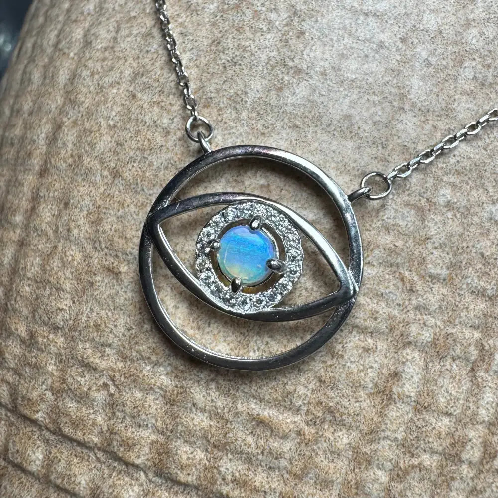 Silver eye pendant necklace featuring a 0.3ct Lightning Ridge Opal in sterling silver setting