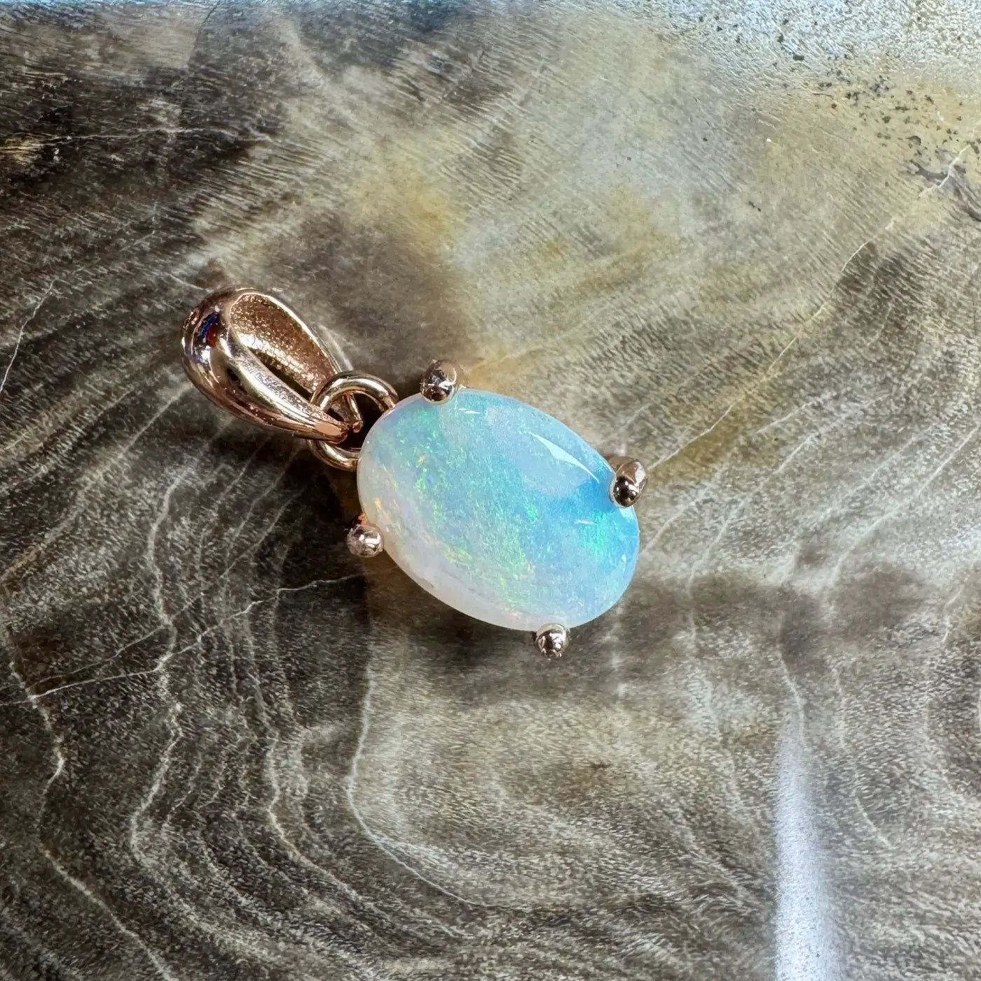 Oval opal pendant with rose gold setting from Blue Water Cove handcrafted jewelry collection