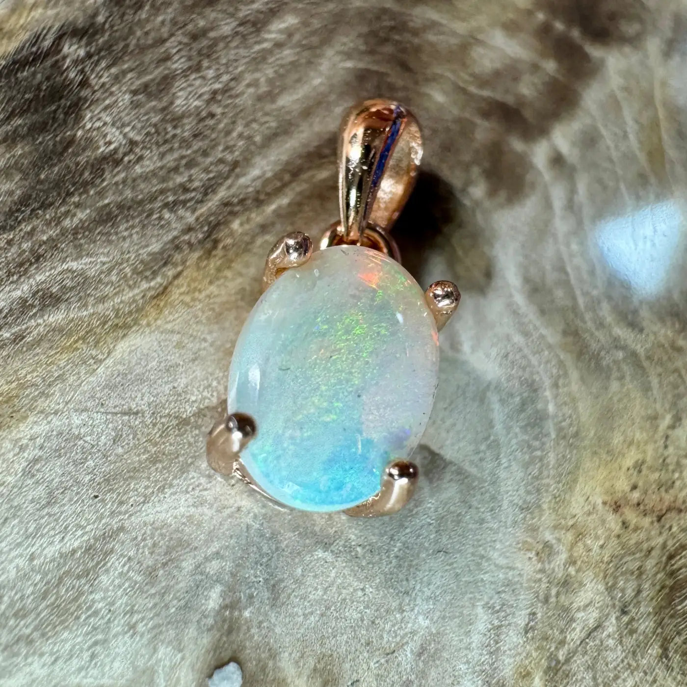 Oval opal pendant with rose gold setting from Blue Water Cove handcrafted 0.8ct Lightning Ridge Opal