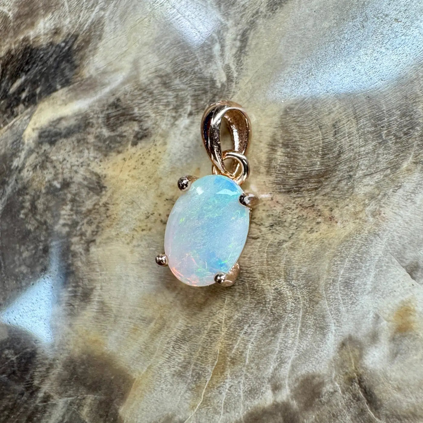 Oval opal pendant with rose gold setting from Blue Water Cove handcrafted jewelry collection