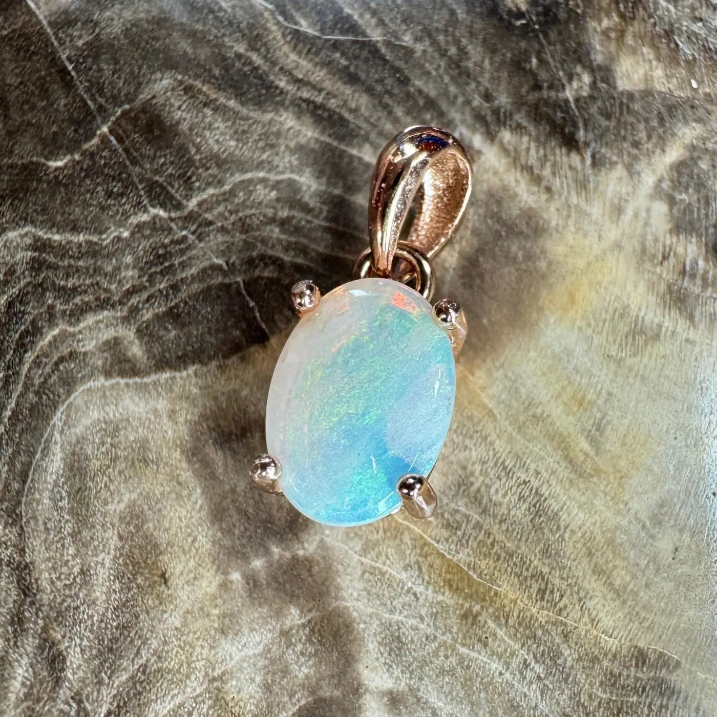 Oval opal pendant with rose gold setting from Blue Water Cove handcrafted jewelry collection