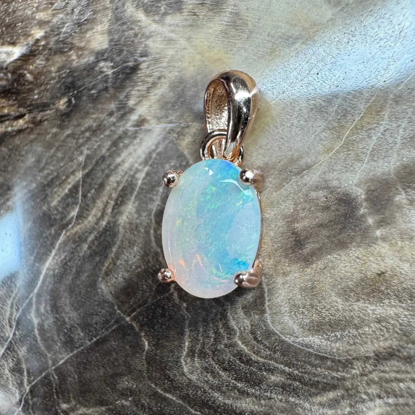 Oval opal pendant with rose gold setting from Blue Water Cove handcrafted jewelry collection