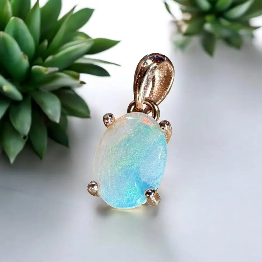 Oval opal pendant with gold prongs from Blue Water Cove handcrafted Lightning Ridge opal necklace