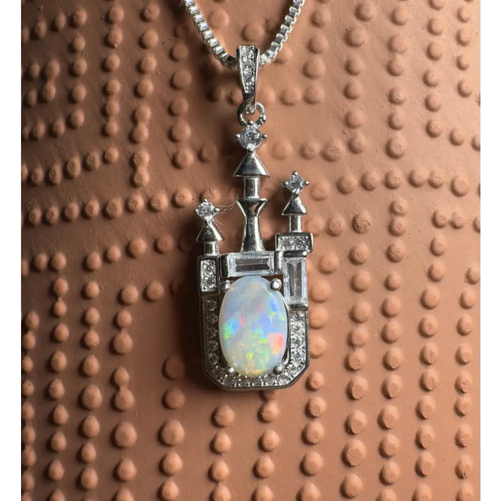 Castle-shaped opal pendant with Lightning Ridge opal and cubic zirconia in sterling silver
