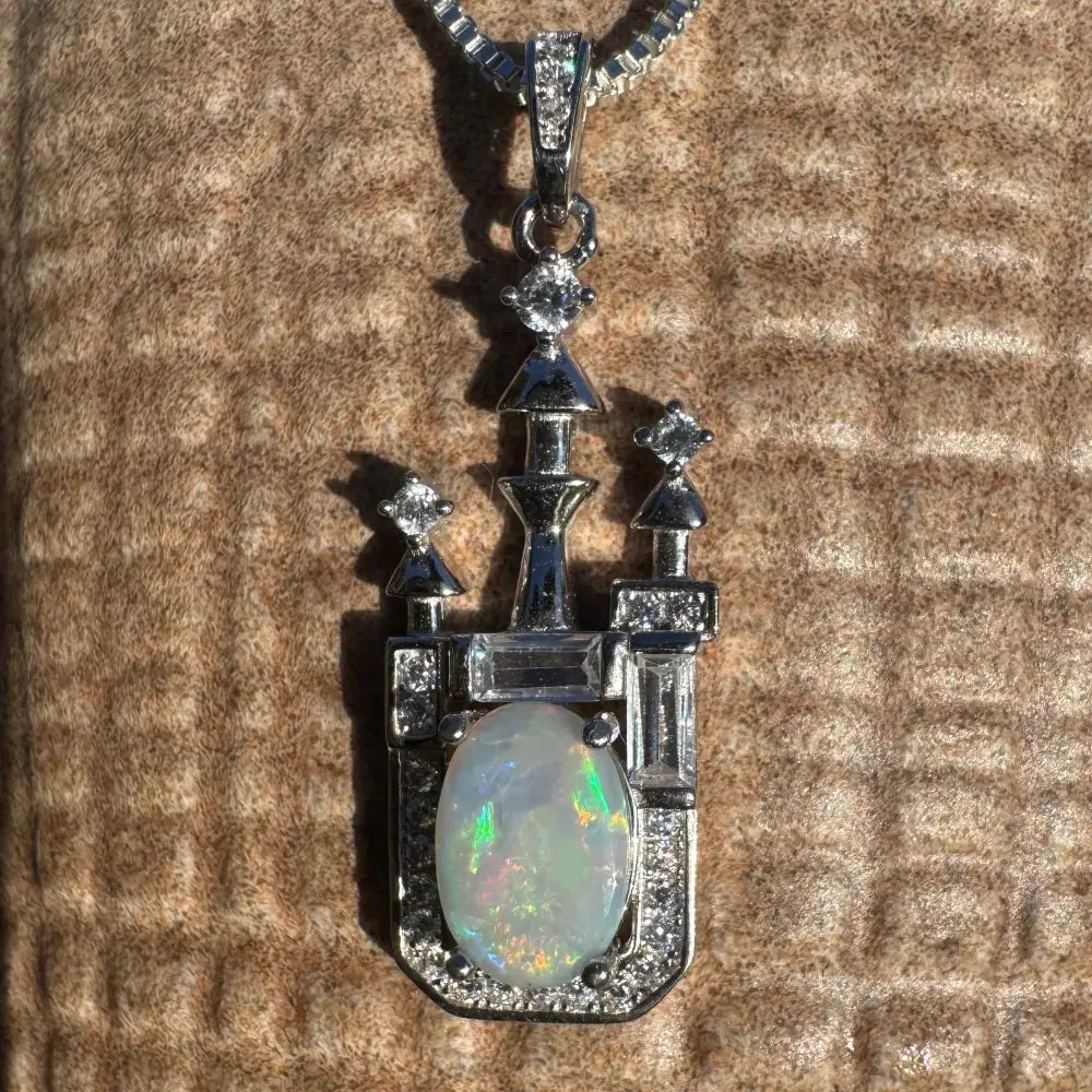 Castle-shaped opal pendant in sterling silver with Lightning Ridge opal and cubic zirconia