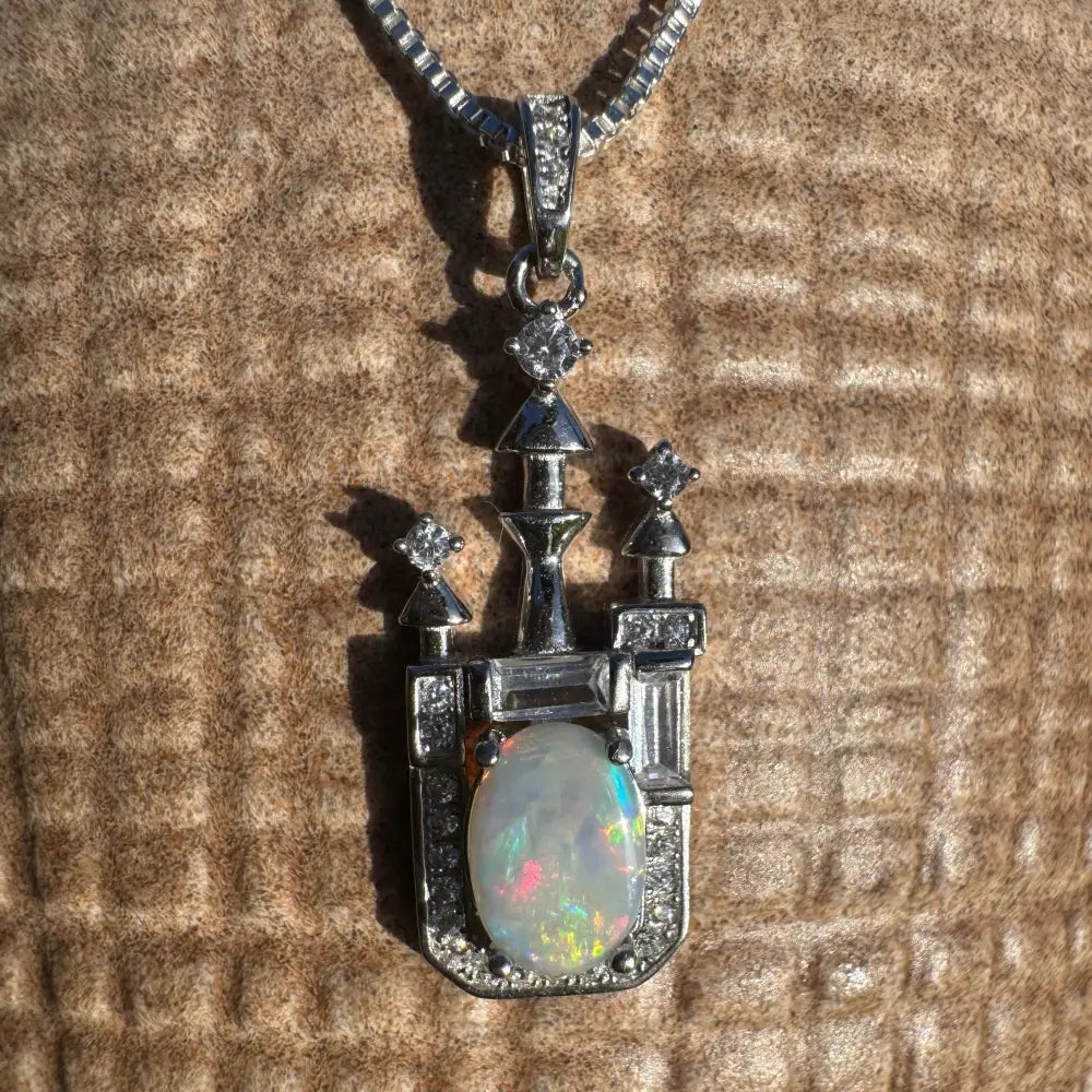Silver castle pendant featuring a 1.0ct Lightning Ridge Opal and Cubic Zirconia
