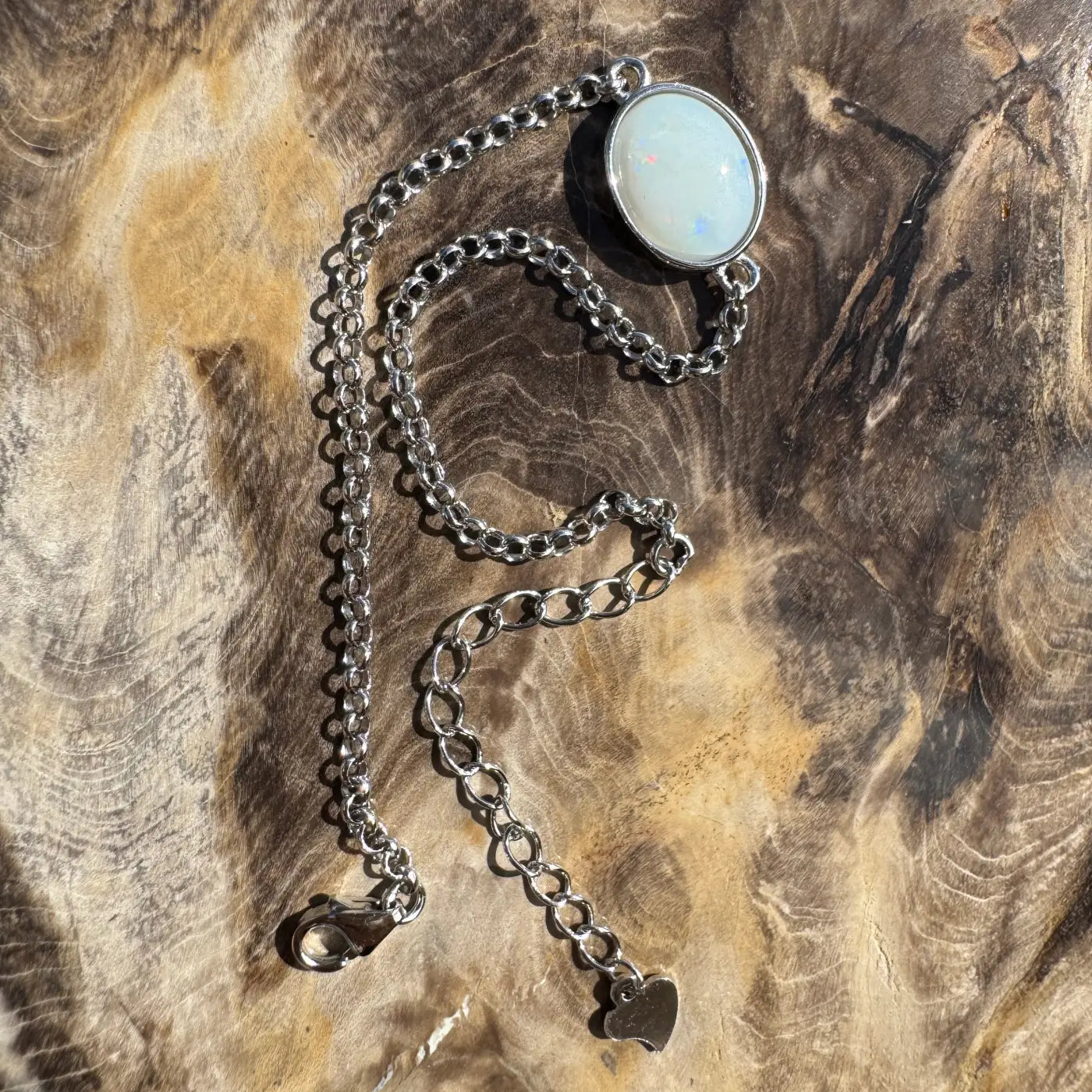 Silver chain necklace featuring an opal-like stone from Celestial Reef handcrafted bracelet