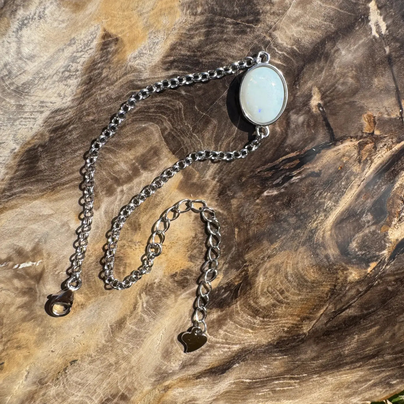 Silver chain bracelet with oval Coober Pedy opal in handcrafted Celestial Reef jewelry piece