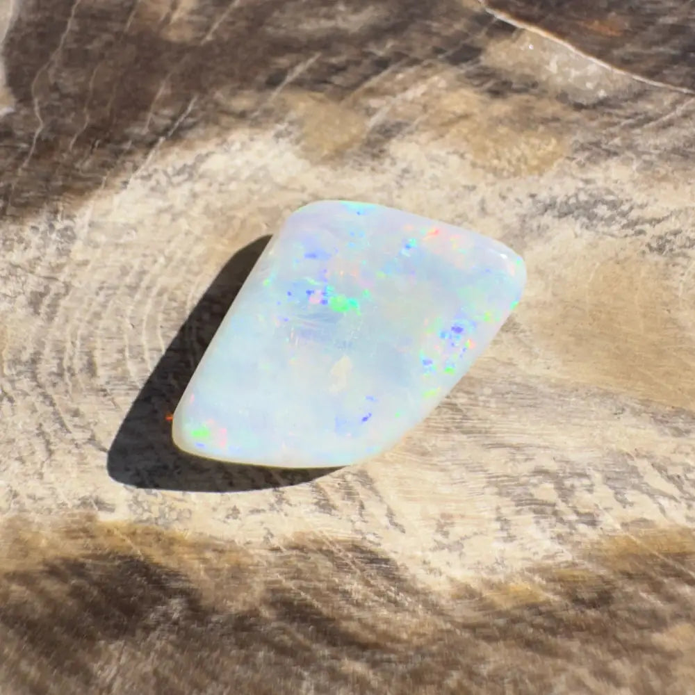 Iridescent white opal gemstone from Coober Pedy Belemnite Opal 2.1 carats
