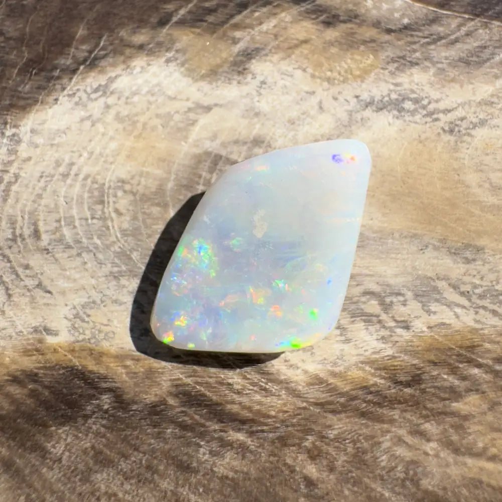 Iridescent white opal gemstone from Coober Pedy Belemnite Opal 2.1 carats