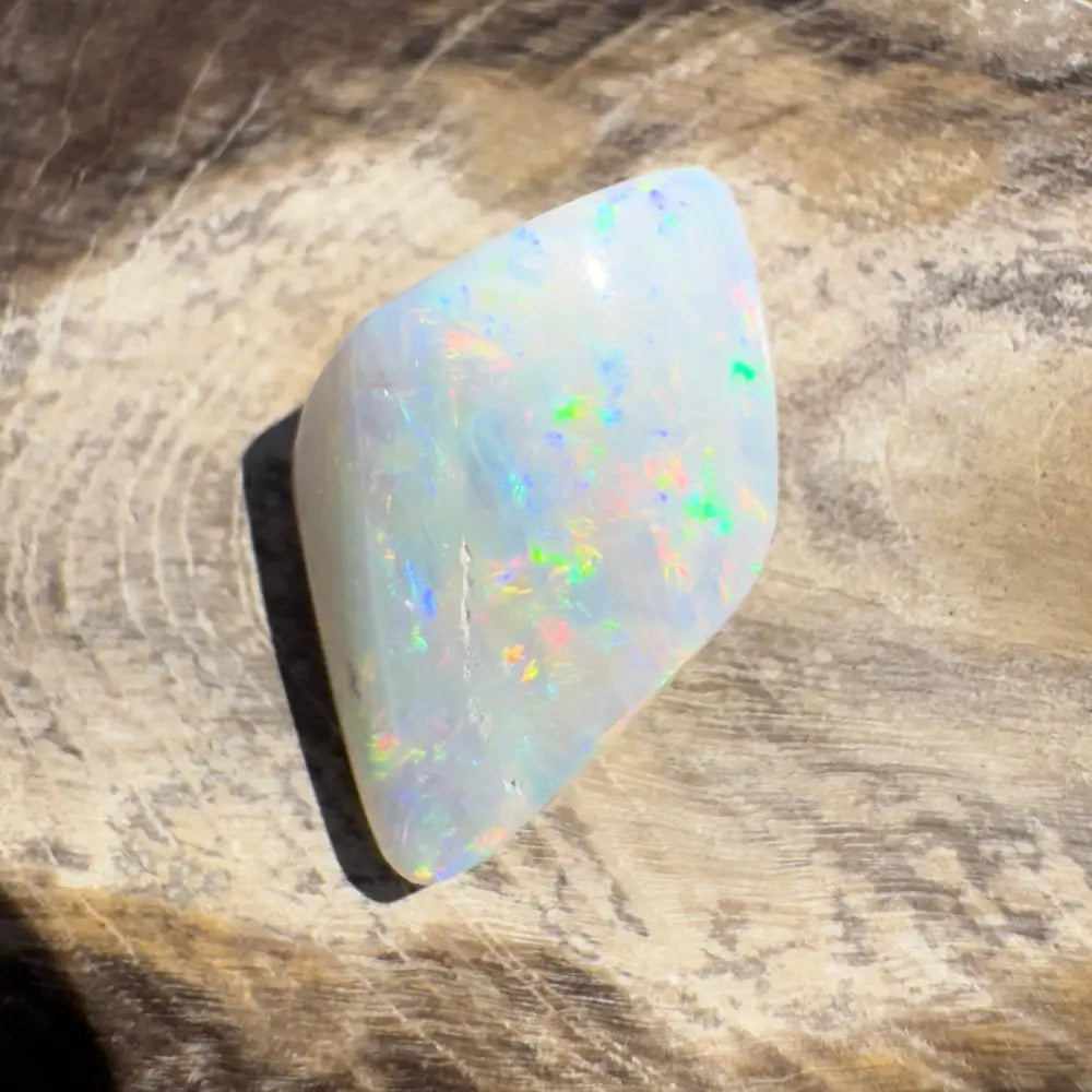 Iridescent white Opal gemstone in Coober Pedy Belemnite Opal 2.1 carats solid display