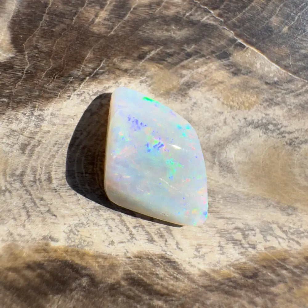 Iridescent white opal gemstone in Coober Pedy Belemnite Opal 2.1 carats solid