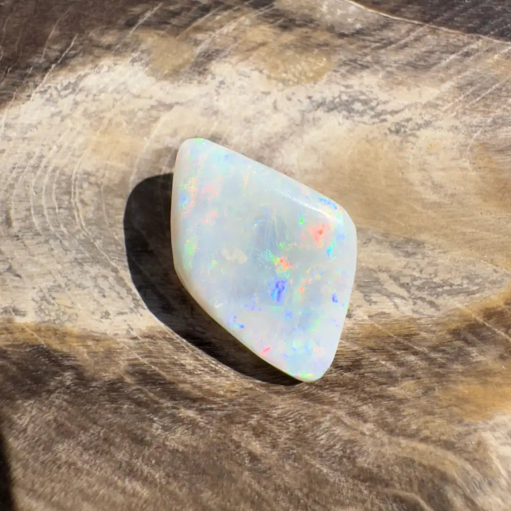 Iridescent white opal gemstone from Coober Pedy Belemnite Opal 2.1 carat solid product