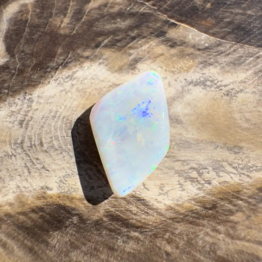Iridescent white opal gemstone in Coober Pedy Belemnite Opal 2.1 carats solid