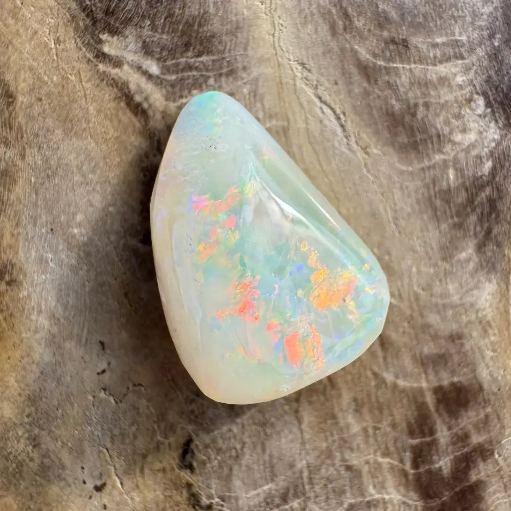 Polished Coober Pedy Opal gemstone with iridescent flashes, 3.3 carats, solid hand-cut