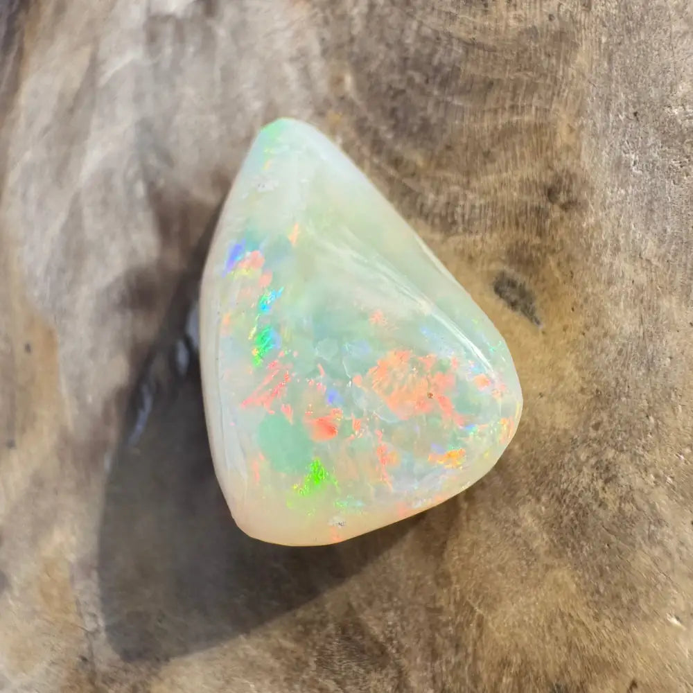 Polished Coober Pedy Opal 3.3 carat gemstone with iridescent play-of-color