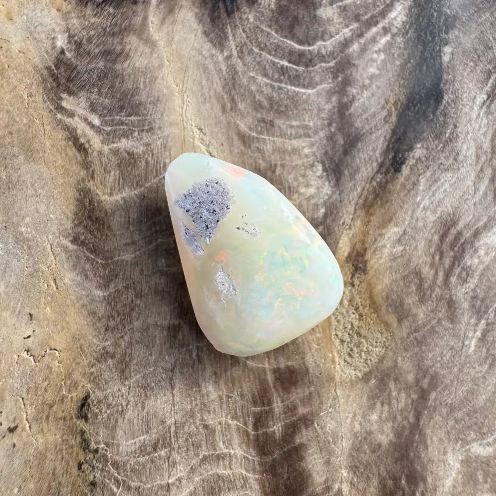 Polished Coober Pedy Opal 3.3 carat solid hand-cut gemstone with blue and orange inclusions
