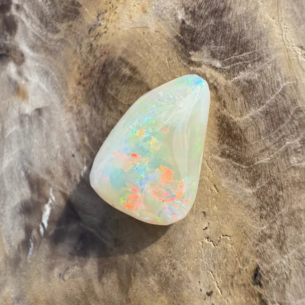 Polished Coober Pedy Opal 3.3 carats with iridescent flashes and hand-cut craftsmanship
