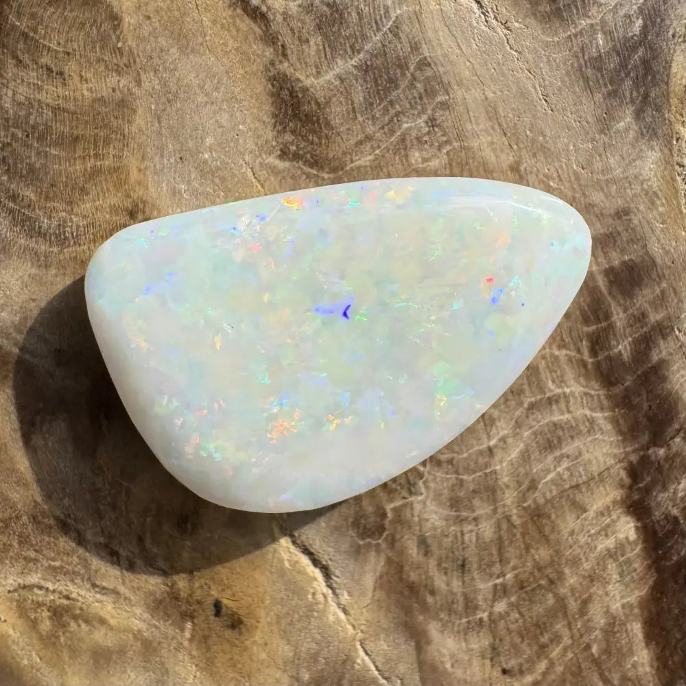Polished white opal with iridescent flashes in Coober Pedy Opal 8.4carat solid hand-cut