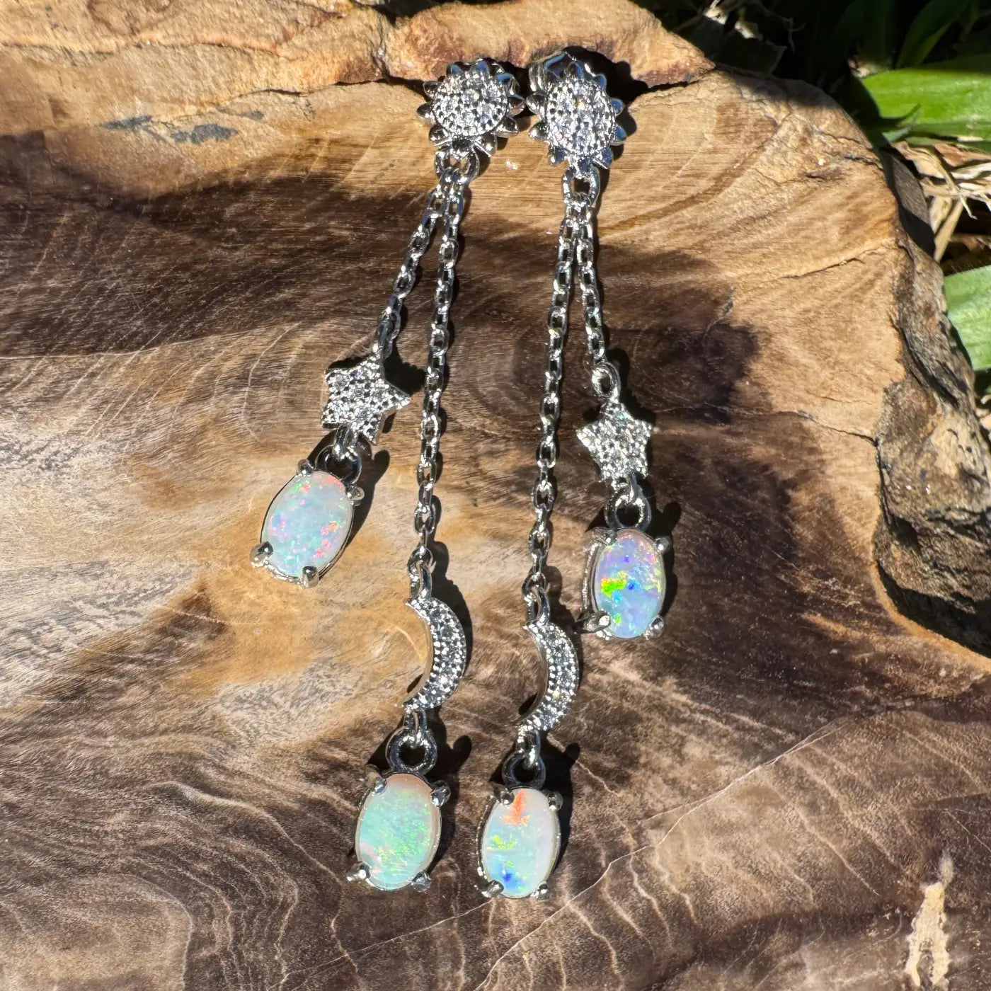 Silver opal dangle earrings featuring Coober Pedy and Lightning Ridge opals with cubic zirconia accents
