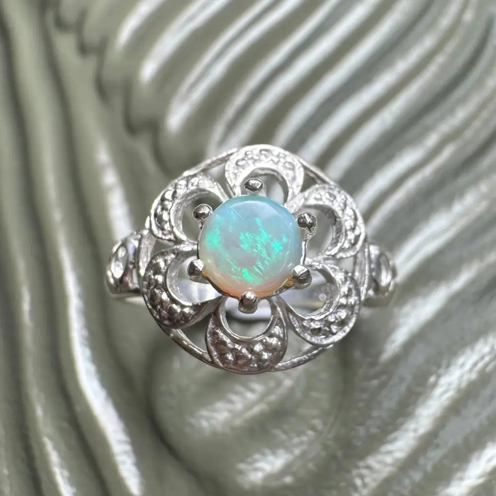 Silver opal ring featuring a 0.7 carat Lightning Ridge opal in 925 sterling silver