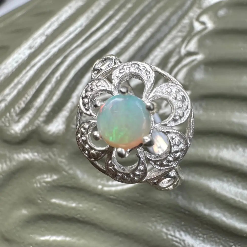 Silver ring with a 0.7ct Lightning Ridge Opal gemstone from Daintree Jewel