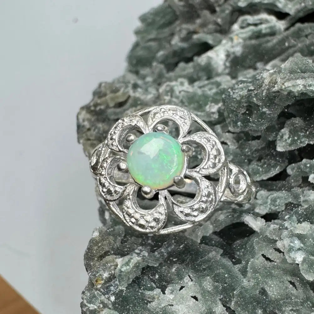 Silver opal flower ring from Daintree Jewel featuring a 0.7ct Lightning Ridge Opal