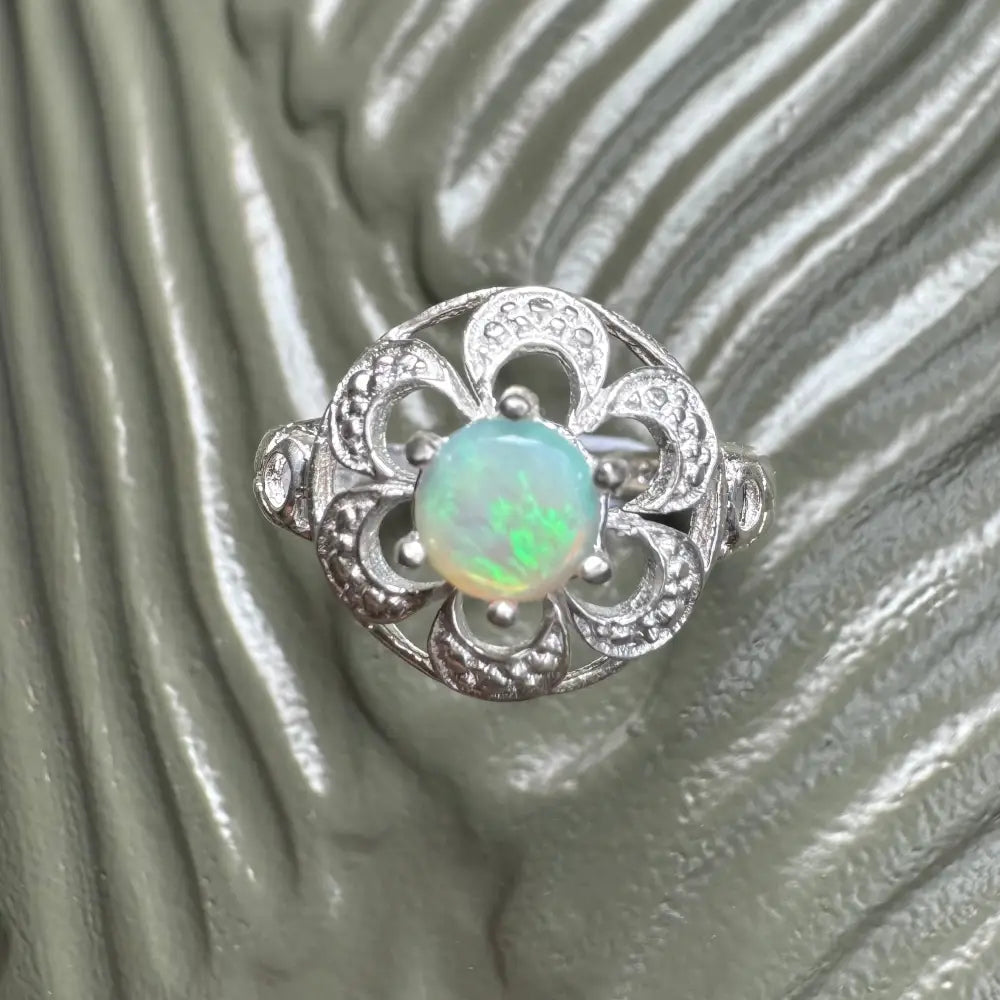 Silver opal flower ring with a 0.7ct Lightning Ridge opal in a Sterling Silver setting
