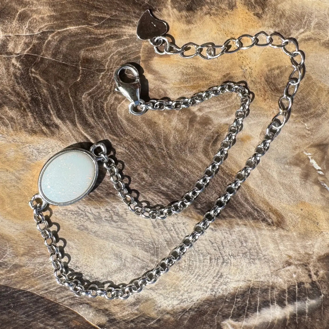 Silver chain bracelet with white oval Coober Pedy opal gemstone in handcrafted sterling silver