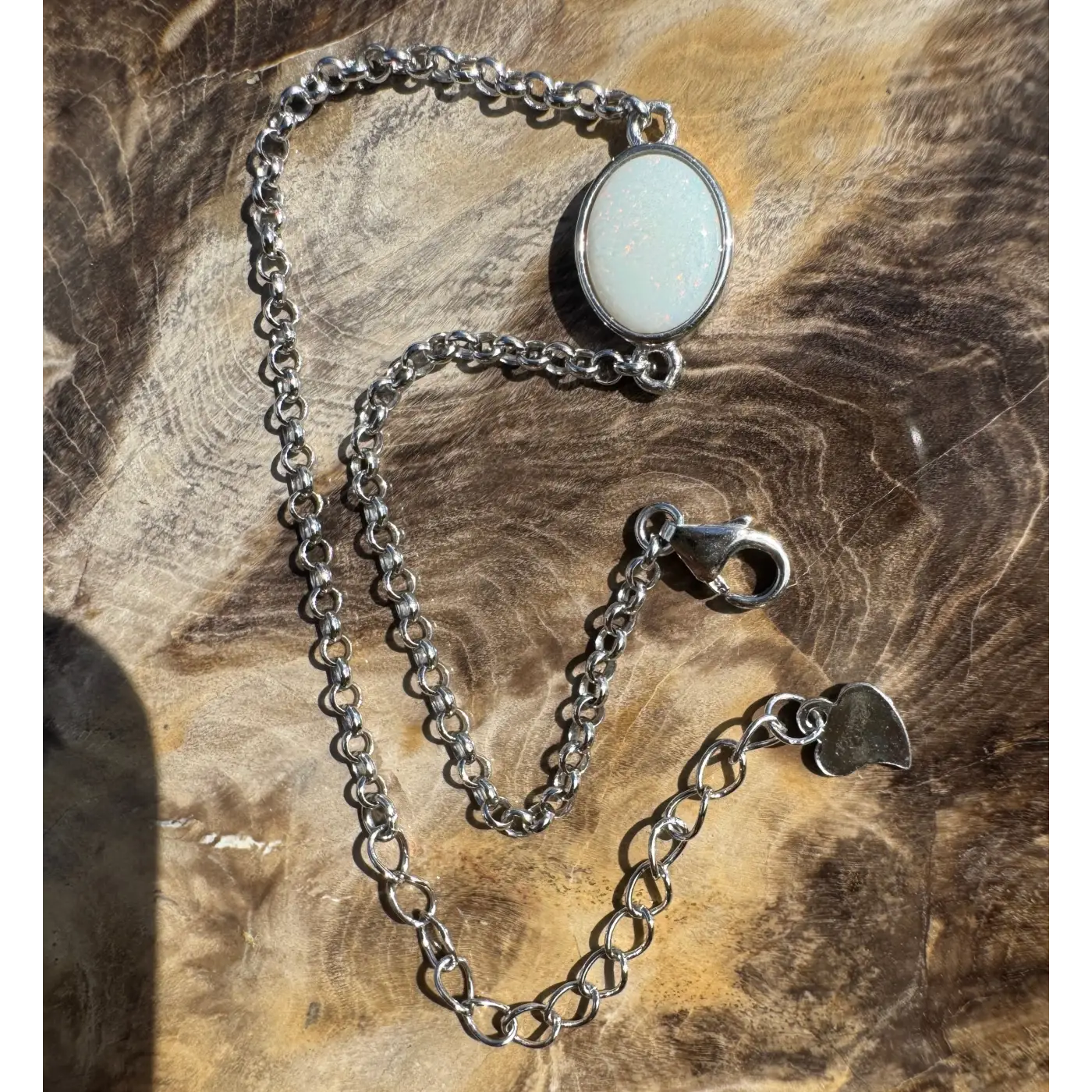 Silver chain bracelet with an oval white Coober Pedy opal, handcrafted sterling silver jewelry