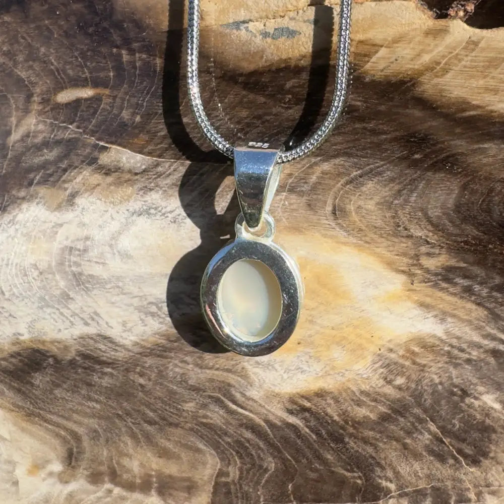 Silver pendant necklace with oval opal.