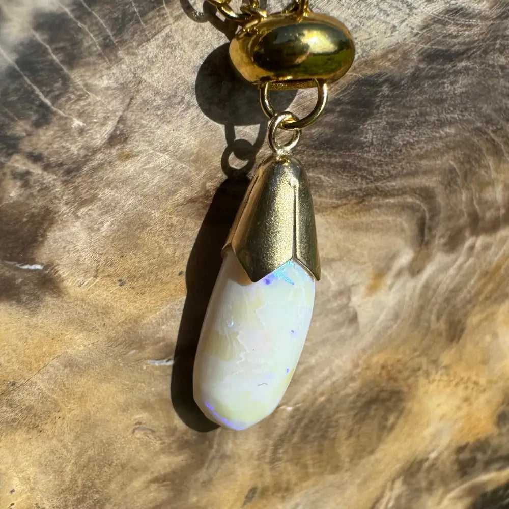 Gold-trimmed Lightning Ridge White Opal pendant from Golden Horizons handcrafted in 9ct solid gold
