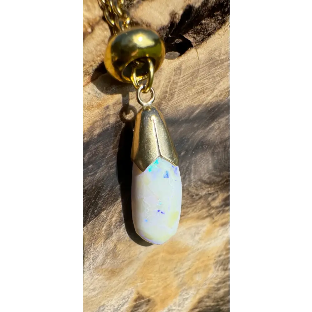 Gold-trimmed Lightning Ridge White Opal pendant necklace from Golden Horizons collection
