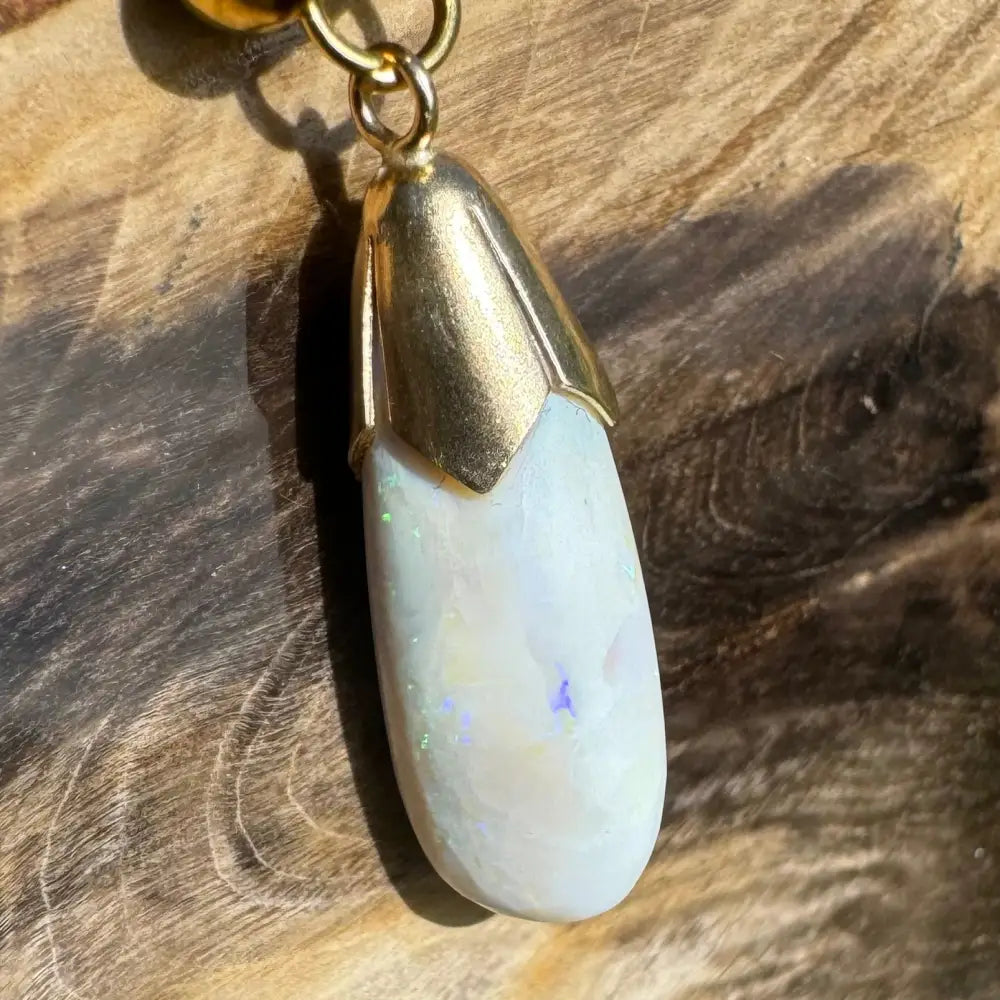Gold-capped Opal Pendant from Golden Horizons featuring handcrafted 9ct solid gold and Lightning Ridge white opal